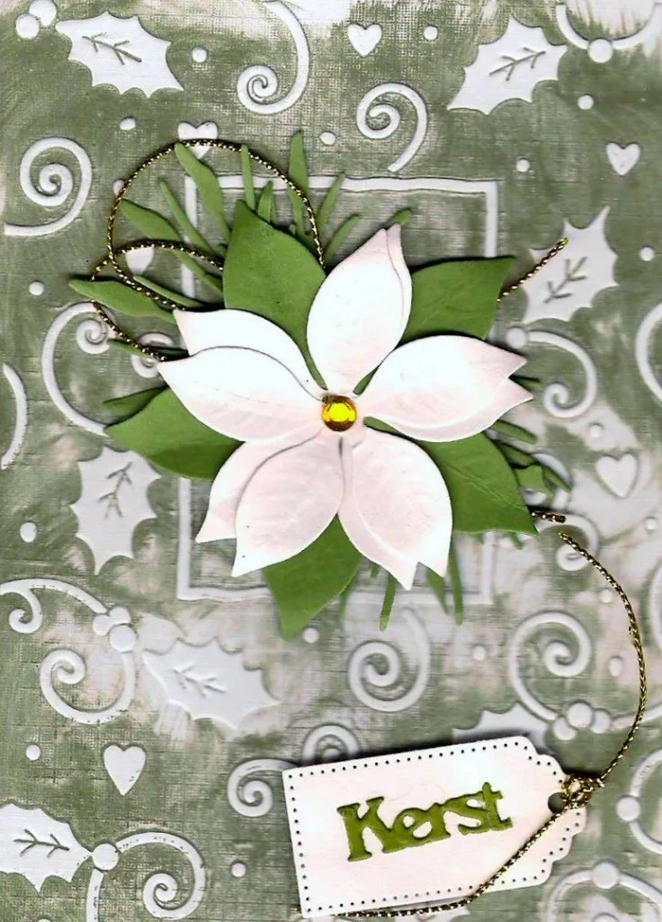 Witte kerstster met kerstlabel
